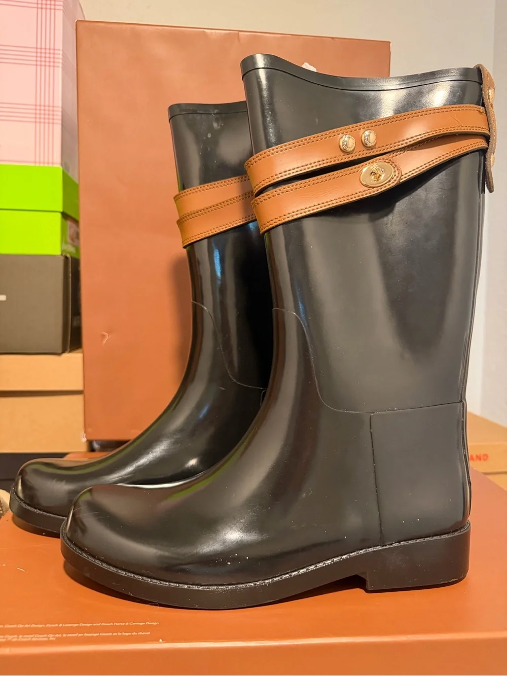 Coach Black Rain Boots with Tan Strap and Gold Accent
